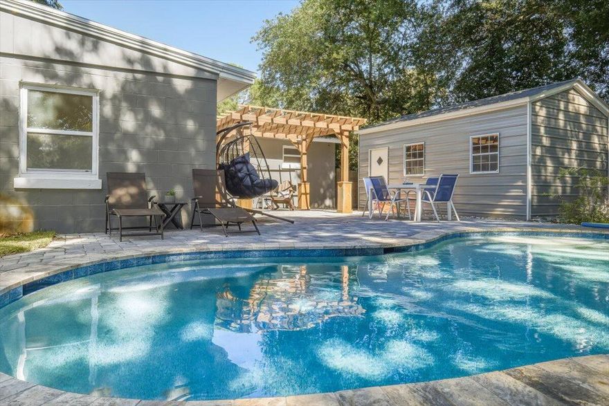 WOW! Gorgeous, updated home in the highly desirable Elliott Point neighborhood. This great home is just 1 block from the Choctawhatchee Bay, less than 2 miles to the beach, and a short golf-cart ride to Historic Downtown FWB.
Home features include:
Large open kitchen w/ island, espresso cabinets, granite countertops & stainless steel appliances
Travertine tile in kitchen, dining, baths, hallway & laundry; hardwood floors in bedrooms.
Primary suite w/ walk-in travertine shower (pebble floor & mosaic accents) + large walk-in closet
Private backyard oasis w/ paver patio, pergola & Hybrid Gunite pool w/ heater & chiller. Pool & equipment have 8 years left on transferable warranty. Effective Year Built: 2010. All copper wiring
HVAC (2024) & water heater (2023) Effective Year Built is 2010! All copper wiring. 1 car garage. HVAC was replaced in 2024. Water heater in 2023. Yard building/workshop in back corner has power and its own breaker box. Nice back deck with beautiful brick pavers leading to your private oasis to relax and unwind in your private pool. Pool and equipment has 8 years left on the warranty and is transferable to the new owner. Lg privacy fenced backyard w/ a sprinkler system on a timer w/ a well for easy lawn care. Decorative brick pavers in the driveway w/ extra parking & double gate on both sides of the home.  Call to see today & make this your little piece of paradise!