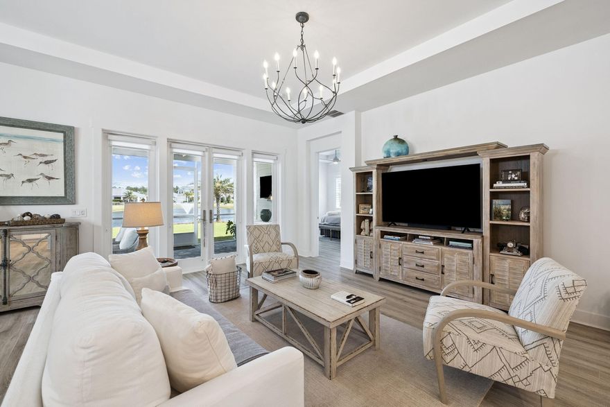 Live in a private, gated community and enjoy resort living.  Purhase this 'like new' home in the best area of the neighborhood.  Home site is situated on a  water view lot where you can relax in the screened-in Lanai while enjoying views of palm trees in your yard and and the lovely sound of the pond fountain.  With a open floor plan and excellent natural daylight you will enjoy  spacious kitchen that opens to the DR and LR.  This home is the single level Lardeo floor plan of 1952 sq. ft. 
Currently, there are two bedrooms and a private flex room that is currently used as an office,but easy to convert to a 3rd bedroom if needed.  An easy walk to the community center and a 12-15 minute  walk to TownCenter with shopping, restaurants, medical office and a Publix.