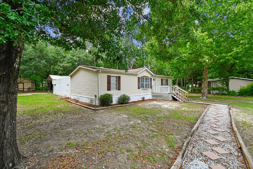 Looking for space, privacy, and easy coastal living?  This beautifully updated home checks all the boxes! Situated on approximately 3/4-acre corner lot in a quiet community just a short drive from the community dock, this property offers the perfect blend of laid-back lifestyle and everyday convenience.  Completely updated, the home features LVP flooring, fresh interior paint, new appliances, and a new HVAC system for added comfort and peace of mind.  Inside, you'll love the split-bedroom floor plan, open kitchen with an eat-in dining area, separate laundry room, and flexible living spaces designed to fit your lifestyle.  Whether you need a home office, media room, guest room, or creative space, the additional room offers endless possibilities.  Step out and enjoy the covered back porch, spacious backyard, and fenced area perfect for pets, outdoor entertaining, gardening, or simply relaxing under the Florida sunshine.  The durable PVC fencing offers low-maintenance living so you can spend more time enjoying life and less time on upkeep.  Love boating, fishing, kayaking, or spending weekends on the water?  This location provides convenient access to deep water and is just a short drive to the Gulf, making it ideal for outdoor enthusiasts and coastal adventurers alike.  The property includes a workshop wired with electricity, dedicated boat parking, and plenty of room to add a garage, additional storage, or expand your outdoor setup. Located in a fast-growing area with room to live, play and grow, this property offers an incredible opportunity for a primary residence, vacation to get away, or investment property.  Buyer to verify all information, dimensions, zoning and any details important to buyer.