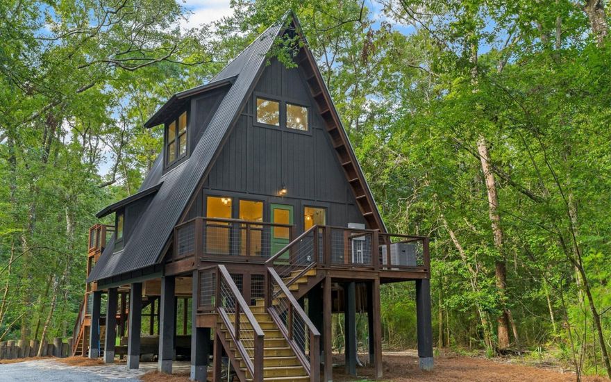 Tucked away in the quiet beauty of North Walton County, this unique property at 493 Choctawhatchee River Rd offers the perfect blend of outdoor adventure and coastal convenience. Whether you're searching for a private getaway, an income-producing investment, or both, this property delivers.

Positioned directly on the Choctawhatchee River, this home is a dream retreat for hunting and fishing enthusiasts. Spend your mornings casting a line, your afternoons exploring nearby wildlife areas, and your evenings unwinding in peaceful, natural surroundings. With abundant game and excellent fishing opportunities nearby, this is true Old Florida living at its finest.

Built in 2024 and offered fully furnished, this home features luxury finishes throughout, quartz countertops, LVP flooring,