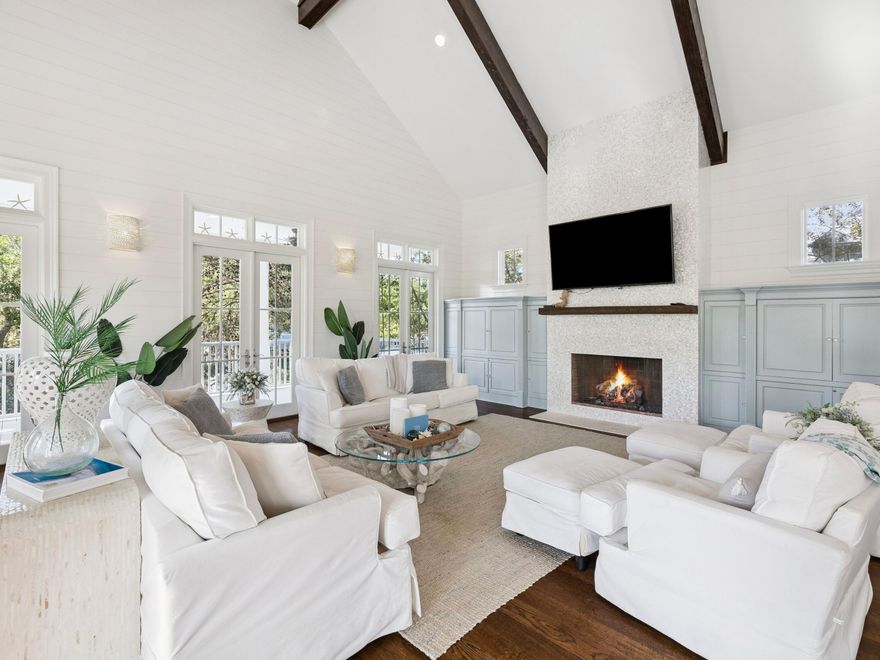 Experience refined coastal luxury in this exceptional five bedroom, four full and one half bath residence spanning 3,774 square feet, ideally positioned on one of the most sought after lots in WaterColor's highly desirable Phase 3 within the coveted Lake District. Set on a premier corner lot, the property offers privacy on three sides, creating a setting that feels far more secluded than most.

Just moments from Western Lake and a short bike ride to the beach, this beautifully appointed home offers the perfect blend of elegance, comfort, and true resort style living. The wrap around porch is a standout feature, giving you multiple spaces to relax, entertain, and take in the surroundings throughout the day. Designed for both relaxation and entertaining, the home features a private pool, complemented by a newly enhanced pergola and thoughtfully designed outdoor living spaces, ideal for al fresco dining and lounging in a serene setting.

Inside, the home showcases timeless coastal design and quality craftsmanship throughout. The gourmet chef's kitchen is outfitted with a six burner gas range, custom vent hood, premium appliances, wine refrigerator, warming drawer, and an expansive island with bar seating. The main living area is highlighted by soaring vaulted ceilings, exposed beams, a statement fireplace, and elegant shiplap detailing, creating a warm yet elevated atmosphere.

Recent updates, including fresh interior and exterior paint and upgraded outdoor features, enhance the home's pristine condition and modern appeal. A spacious third floor game room with custom built bunks offers a versatile retreat for guests and gatherings.

Owners enjoy access to WaterColor's world class amenities, including multiple resort style pools, tennis and pickleball courts, a state of the art fitness center, scenic parks, and a boathouse for paddleboarding and kayaking. Camp WaterColor adds to the experience with its lazy river, waterslides, and family friendly activities. The property conveys 14 owner wristbands, a meaningful advantage for both personal use and rental flexibility.

This is a rare opportunity to own a truly distinguished home in one of 30A's most sought after coastal communities.