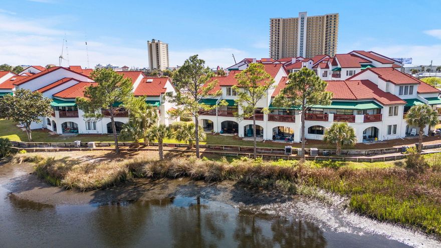 This villa at St Thomas Square offers a relaxing space for enjoying all that Panama City Beach has to offer. Whether that be as your own personal home or as a beach rental! This unit is furnished and ready to be enjoyed! Grand Lagoon, located just steps out the back door, is excellent for fishing, observing wildlife and boating. The St Thomas Square dock is a short walk down the paved pathway and is one of the few condominiums on PCB that has the availability for a dock tie up. Enjoy the resort style pool, fire pit, sauna or clubhouse amenities and don't forget about pickleball and tennis! If you have a boat it can be docked in one of the dock boat slips which is able to accommodate boats as large as 25 ft.