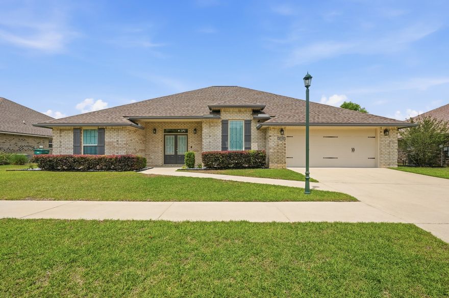 Welcome to the beautiful gated community of Chanan Estates, ideally located in South Crestview with low county taxes! This stunning all-brick home, built in 2019, offers 2,410 square feet, featuring 4 bedrooms, 3 bathrooms, and a highly desirable open-concept, split floorplan.

Step inside to find 10-foot ceilings and elegant porcelain plank wood-look tile flooring throughout all main living areas and bathrooms, with comfortable carpeting in the bedrooms. The spacious living, dining, and kitchen areas create a bright and inviting atmosphere--perfect for both everyday living and entertaining.

The primary suite is a true retreat, complete with a tray ceiling with backlit crown molding, dual walk-in closets, and a luxurious en-suite bath featuring quartz countertops, dual vanities, a soaking , separate tiled walk-in shower with frameless glass door, and a private water closet. All bedrooms include walk-in closets, plus an additional walk-in linen closet for ample storage.

The kitchen is designed to impress with:

Quartz countertops
Deep white farmhouse sink
Large island with bar seating
Walk-in pantry
Stainless steel appliances, including an upgraded Samsung slide-in range, Whirlpool microwave, dishwasher, and French door refrigerator
Ceramic tile backsplash
Dimmable LED under-cabinet and recessed lighting
Stylish pendant lighting over the bar

Additional interior features include:

Ceiling fans in all bedrooms, plus a double fan in the living room
A well-equipped indoor laundry room with granite countertops, cabinetry, and storage drawers

Enjoy outdoor living with a welcoming front porch with double-door entry and a large covered back lanai, overlooking a privacy-fenced backyard.

This home is packed with upgrades and practical features, including:

Two-car garage with automatic opener and attic access
Gutter system
Rainbird irrigation system
Lorex security camera system
PEX Manibloc plumbing system
Transferable termite bond

Conveniently located on the south side of Crestview, this home offers an easy commute to the Emerald Coast beaches and nearby military bases.

Don't miss your chance to live in this highly sought-after gated community--schedule your private showing today!