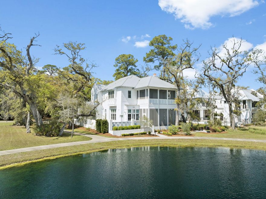 Rarely available and meticulously maintained, this sophisticated lakefront residence at 29 Tyler Drive offers a masterclass in modern Southern elegance within the gated sanctuary of Churchill Oaks. Spanning 3,982 square feet, this custom-built home anchors its prime lakeside position with striking architecture, pristine white-washed brick, and expansive wrap-around porches designed to capture serene water views and refreshing coastal breezes. The interior is defined by high-end finishes, including rich hardwood flooring, a chef's kitchen with a massive social island and premium appliance suite, and a spacious first-floor primary retreat featuring a spa-inspired bath. Designed for a seamless indoor-outdoor lifestyle, the home features a screened-in lakeside porch that serves as a tranquil secondary living space overlooking the spring-fed lake. Residents of 29 Tyler enjoy an ideal location within walking distance to the community's world-class amenities, including the 8,000-square-foot bayfront clubhouse, resort-style infinity pools, fitness center, and a private deep-water marina. Representing the pinnacle of luxury and tranquil waterfront living, this residence is a rare opportunity to enter one of Santa Rosa Beach's most coveted neighborhoods at an exceptional value.