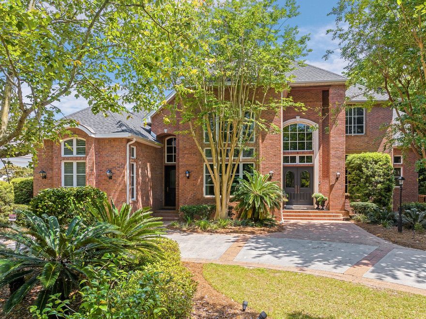 Stunning Custom Estate in Prestigious Kelly Plantation - Gated Golf & Lakefront Living Nestled into lush foliage adjacent to the 8th hole of the Kelly Plantation golf course and backing up to a serene lake, this exceptional 6,020 sq ft custom-built home offers tranquil resort-style living in one of Destin's most sought-after gated communities. Built in 2001 with outstanding architecture and meticulous attention to detail, this 4-bedroom, 5 full + 1 half bath residence welcomes you through grand double mahogany doors into a dramatic 27-foot ceiling foyer. An elegant wooden arched staircase with wrought-iron balustrade leads upstairs, setting the tone for the home's timeless elegance. Highlights include: Walnut-paneled two-story study with a hidden ''secret room,'' extensive built-in bookcases and bonus office space. Gourmet kitchen designed for serious entertaining, featuring high-end Viking, Bosch, Sub-Zero, and Fisher & Paykel appliances, a striking brick-surrounded double oven and hood, the large pantry with authentic 1700s French doors and hardware, multiple sinks, icemakers, dishwashers, and more. Four spacious bedroom suites -- each with coffered ceilings, large walk-in closets, and private ensuite baths (primary bath boasts a spa tub, heated porcelain floors, and a multi-head shower). First-floor mother-in-law suite with private entrance and kitchenette. Oversized upstairs media room with blackout drapes. Six indoor fireplaces plus one outdoor, plus four HVAC units for year-round comfort. Additional first-floor office, multi-use beverage center with copper sink, powder room, and laundry. Step outside to your private oasis: a screened terrace overlooking the lake and golf course, a refreshing 30x14 salt water pool with pool cabana, and multiple open terraces and covered porches ideal for al fresco dining and relaxing. The 3-car garage features hurricane-proof doors, and a full security camera system provides peace of mind. Kelly Plantation offers golf, tennis, pickleball, multiple pools, a remodeled Owners Club, and more. Just minutes from world-class Destin beaches, dining, shopping, and entertainment. Conveniently located near Destin Middle and High Schools. This one-of-a-kind estate combines luxury, privacy, and functionality on a beautifully landscaped ~0.52-acre lot. A rare opportunity in the heart of Destin.