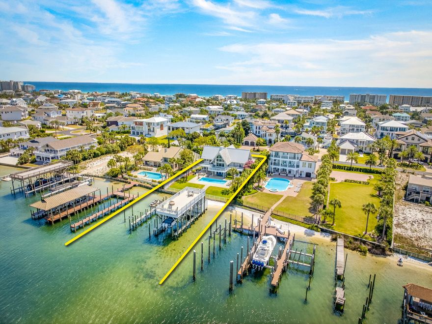 EXTRAORDINARY, DEEP-WATER, YACHTSMAN'S & SPORTSFISHERMAN'S WATER-FRONT ESTATE oriented on Destin, Florida's Scenic Harbor.  Located within the legendary enclave of Holiday Isle, this exclusive address is the only harbor-front estate currently offered for sale and rarely do like-kind opportunities arise on the South side of the gorgeous Harbor due to such a limited density of lots fronting the harbor. Holiday Isle is unique in that it offers dedicated beach access for its ownership and their guests, which is afforded through very reasonable dues, currently $495.00/annually.  An estate of this caliber and distinction should be viewed as a generational ownership opportunity, as the phenomenal lifestyle it offers is unrivaled anywhere along the Emerald Coast on the Gulf of America.  This property has been beautifully renovated and newly decorated and is being offered turnkey; fully furnished and accessorized with all audio and video.  The dock structure and its features are irreplaceable; "grandfathered" specifications, thus providing an instant solution to moor and lift your boats, yachts, skid for jet skis, paddleboards, tackle/storage room, motorized catch lift and guided aluminum rails to the fish cleaning station, and a magnificent rooftop sunbathing  and stargazing terrace atop two of the covered slips; all accessible directly from your private backyard, which includes an expansive heated pool.  The hardscaping, landscaping, and ambient exterior and dock lighting accentuate the distinctive roof and dock elevations. Quite a scope of improvements have recently been completed, including but not limited to the following: (2) natural gas Rinnai tankless hot water heaters that supply the entire house; all recessed lights throughout were replaced with efficient LED technology; entire interior repainted including all new moldings; exterior deck painted and sealed; all exterior railings painted; new insulated, modernized garage doors and openers; AquaLink technology that allows for control of the pool functions via smartphone app; Control 4 home automation app also interfaces with the TV's.  (2) new Trane A/C units installed; while all four units have new Trane thermostats controlled remotely via app; oversized double floating jet dock installed; (7) high resolution digital home surveillance cameras with cloud-based NVR; (4) boat dock Luma surveillance cameras.  Wi-Fi module added to the Generac whole house generator allowing for interface with a smartphone app as well. The most extraordinary dock, slips, boathouse, and boathouse rooftop terrace on Holiday Isle with spectacular view corridor of the scenic harbor and fabulous sunsets.  Please inquire for further details and to schedule a private showing.