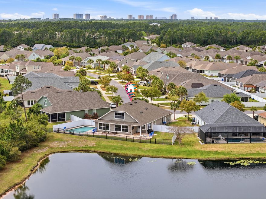 MOTIVATED SELLER - OFFERING $20,000 CONCESSIONS WITH AN ACCEPTABLE OFFER! Waterfront home in Breakfast Point offering approximately 3,200 sq. ft., 4 bedrooms plus a bonus room that can function as a 5th bedroom, and a fully fenced yard with a saltwater pool. Interior features include hardwood floors, high ceilings, formal living and dining area with built-in shelving, and a split-bedroom floor plan. The kitchen opens to the main living area overlooking the pond and includes granite countertops, stainless steel appliances, dual industrial refrigerators, a large kitchen island, pantry, built-in desk/workspace, and a reverse osmosis water filter at the kitchen sink. The primary suite is located off the main living area and includes pond views, double vanity, tile walk-in shower, soaking tub,  full bath, and the walk-in laundry room offers extensive shelving. The upstairs bonus room includes a half bath and can serve as a media room, office, or additional bedroom. Exterior features include a covered tiled patio, paver pool deck, vinyl privacy fencing, and iron fencing along the pond. Pond is catch-and-release with some good-sized bass. All sizes and measurements are approximate and should be verified if important. Some photos are altered or staged using AI for conceptual purposes. Conveniently located within walking distance to Breakfast Point Academy and near shopping, restaurants, Home Depot, the Breakfast Point sports complex, and approximately 2 miles to the beach.