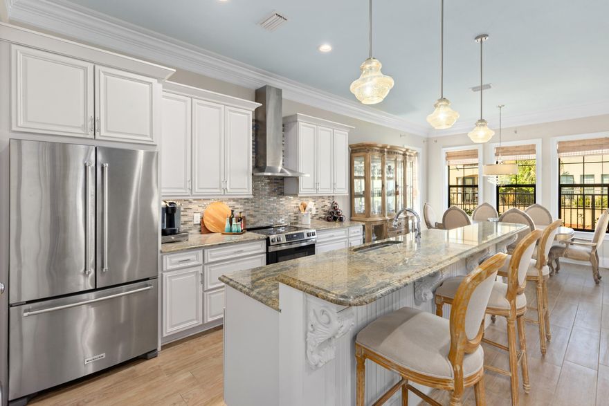 Mediterranean-inspired 3BR & 3.5BA  Sandestin residence includes a rare, true one-car garage, spacious enough to accommodate a vehicle and golf cart (included). The open-concept living space is enhanced by wood plank ceramic tile flooring, high ceilings, and elegant crown molding. The kitchen is designed with custom cabinetry topped with granite countertops, a large walk-in pantry, and stainless-steel appliances. The breakfast bar offers a comfortable spot for morning coffee or casual meals. With its scenic water views, the dedicated dining area is perfect for hosting formal events and entertaining guests.  The first floor also includes a powder room. Upstairs, the primary suite serves as a tranquil retreat. It features a sitting area suitable for a private office or reading nook. Two additional guest suites offer the comfort of their own ensuite bath, providing privacy and relaxation for family and visitors alike. Recently updated 2-ton HVAC system for upstairs (2025)
Bring the indoors out on the inviting, covered back patio, where you can savor serene water views or fire up the grill for unforgettable evenings and breathtaking sunsets.
 As a Villa Lago owner, you'll enjoy exclusive access to the vibrant community clubhouse and sparkling pool, creating a genuine resort-style atmosphere. A golf cart is included with the home, offering effortless access to everything the resort has to offer, including white sand beaches, four championship golf courses, tennis and pickleball courts, fitness centers, the marina, and Grand Boulevard's premier dining, entertainment, and shopping venues. Whether you're seeking a vacation getaway, a primary residence, or an investment property, Villa Lago delivers versatility and luxury for every lifestyle.