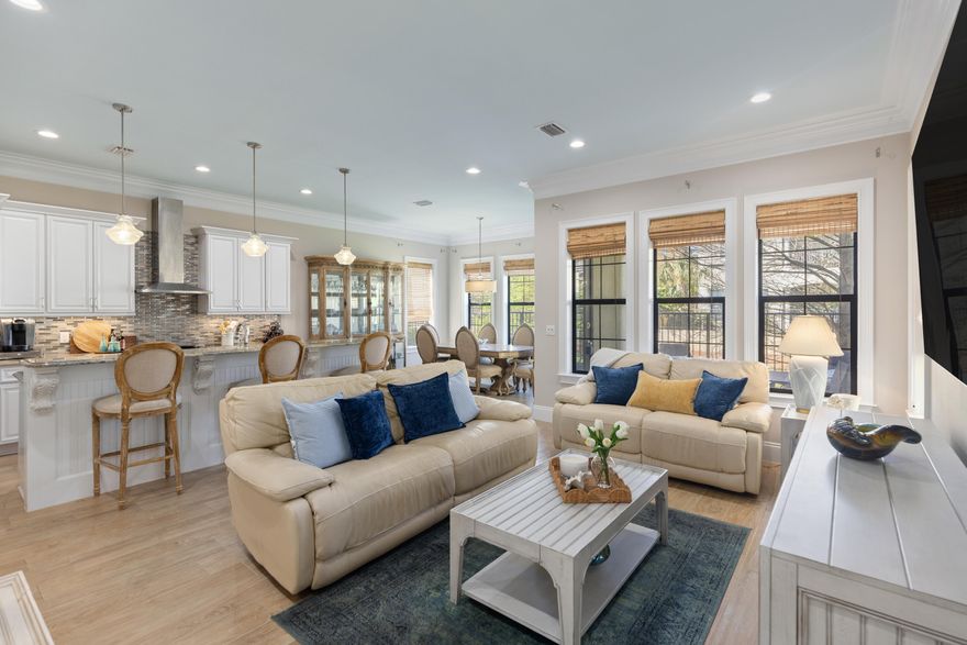 Mediterranean-inspired 3BR & 3.5BA  Sandestin residence includes a rare, true one-car garage, spacious enough to accommodate a vehicle and golf cart (included). The open-concept living space is enhanced by wood plank ceramic tile flooring, high ceilings, and elegant crown molding. The kitchen is designed with custom cabinetry topped with granite countertops, a large walk-in pantry, and stainless-steel appliances. The breakfast bar offers a comfortable spot for morning coffee or casual meals. With its scenic water views, the dedicated dining area is perfect for hosting formal events and entertaining guests.  The first floor also includes a powder room. Upstairs, the primary suite serves as a tranquil retreat. It features a sitting area suitable for a private office or reading nook. Two additional guest suites offer the comfort of their own ensuite bath, providing privacy and relaxation for family and visitors alike. Recently updated 2-ton HVAC system for upstairs (2025)
Bring the indoors out on the inviting, covered back patio, where you can savor serene water views or fire up the grill for unforgettable evenings and breathtaking sunsets.
 As a Villa Lago owner, you'll enjoy exclusive access to the vibrant community clubhouse and sparkling pool, creating a genuine resort-style atmosphere. A golf cart is included with the home, offering effortless access to everything the resort has to offer, including white sand beaches, four championship golf courses, tennis and pickleball courts, fitness centers, the marina, and Grand Boulevard's premier dining, entertainment, and shopping venues. Whether you're seeking a vacation getaway, a primary residence, or an investment property, Villa Lago delivers versatility and luxury for every lifestyle.