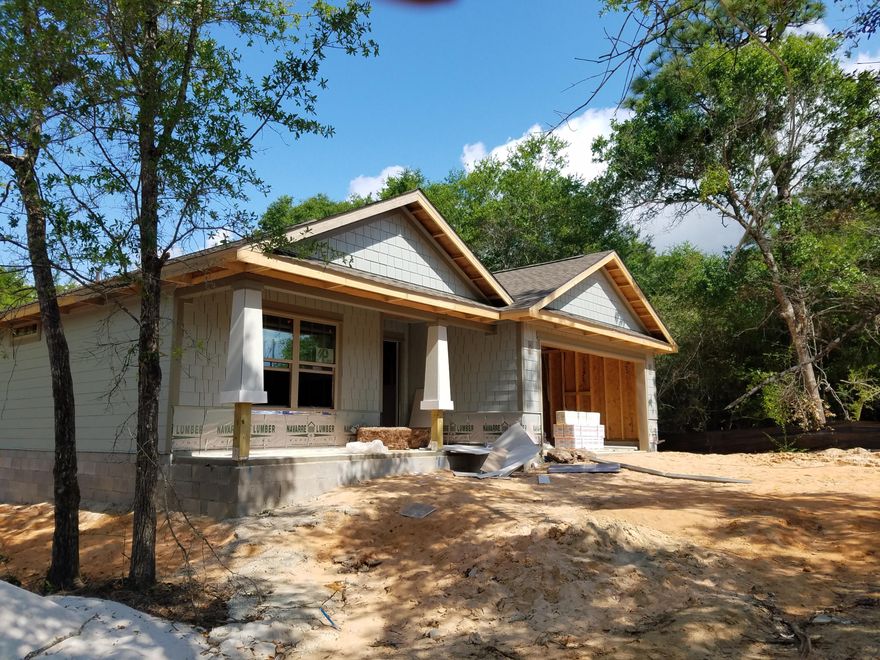 NEW CRAFTSMAN Custom Built Home in EAST NAVARRE, this luxurious 3 bed/2 bath floor plan is under construction and will be ready in time for your Summer move in ~Great Central Location with easy access to Navarre Beach,Navarre Waterfront Park and Hwy 98 to Hurlburt Field AFB.This Stunning Robbins Builders Custom Home offers trend setting features~Greeted by a walk in foyer sweeping through to your open floor plan ~Large kitchen enjoying custom staggered cabinets with crown molding, beautiful granite counter tops~Under mount sink~S/S appliances,large walk in pantry and utility room ~wrap around hop up Center Island with pendant lights ~open flow to the family room,wood laminate through the foyer & main living area With Tiled laundry and bathrooms~ Large Master with trey ceiling & ceiling fan~Master bath offers an oversized TILED shower ~Cultured Marble double vanity~antique bronze fittings with picture frame mirrors. Additional Bedrooms are a great size with double closets and ceiling fans~Home has a welcoming covered front porch and large covered back porch to sit out and enjoy those wonderful Florida evening ,great to cook out and entertain.Large lot with wooded buffer for privacy ~ TAEXX in wall pest control system~ Hurricane protection boards and dimensional shingle roof for lower insurance premium. Upgrades throughout include bullnose corners ,knockdown ceilings, recessed lighting , deluxe lighting package,50 Gallon water heater, garage door remotes, attic drop down stairs~ to name a few..........colors etc Pictures are of a previous home and may vary.....Call today for further information.