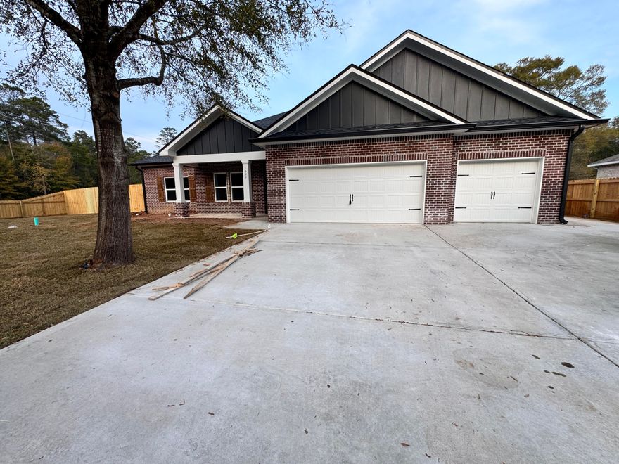 Welcome to your dream home, where modern design meets everyday convenience. This beautiful new construction offers 4 bedrooms, 3 bathrooms, and a spacious 3-car garage across 2,136 sq. ft. of thoughtfully crafted living space. Designed with an open, split-bedroom floor plan, this layout is both functional and inviting, perfect for family living and entertaining. Step inside to discover luxury vinyl plank flooring, 10-foot ceilings in the main areas, and a gourmet kitchen that will impress any home chef. The kitchen showcases sleek quartz countertops, a tile backsplash, soft-close shaker cabinetry, pendant lighting, stainless steel appliances, and a gas range, all complemented by relaxing retreat with a spa-like bathroom featuring a tiled shower, soaking tub, dual vanities, and a spacious  walk-in closet. Each secondary bedroom provides ample space and storage, with two sharing a full bathroom and one featuring its own private ensuite, ideal for guests or a home office setup. Outside, enjoy a large fenced backyard, included refrigerator, blinds, and fence, making your move seamless and stress-free. Located in Niceville near the Mid-Bay Bridge, this home is just minutes from top-rated schools, shopping, dining, and the sugar-white beaches of Destin. Photos are of a similar home built by the same builder. Some details depicted may not be the same.