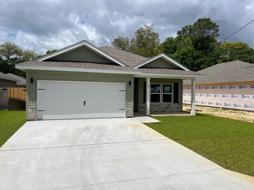 New Construction - features architecturally distinct gables with the classic front porch. The interior has beautiful finishing touches including LVP flooring throughout, nine-foot ceilings with a tray in the master and living area. Open kitchen with custom white shaker style cabinets with easy close doors, granite counter-tops, stainless steel appliances including refrigerator. The dining room leads to the covered back porch grilling area. Both bathrooms have granite countertops and master has large walk-in closet. This is a Good Sense energy efficient home with Low E windows and Rheem HVAC. Home includes privacy fence with gates on both sides. Well irrigation system with Rain Bird timer.