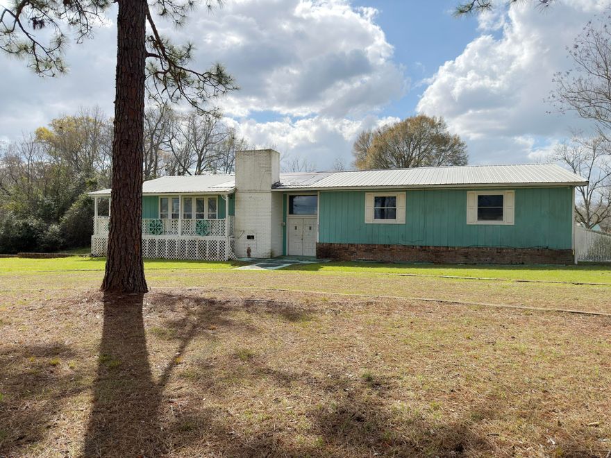 If you are looking for a home that is just minutes from the AL/FL border, comes with some acreage, has a huge floor plan, and has LOTS of potential, then this REO opportunity may just be what you were looking for! This home was built in 1978 and has a finished basement with laundry, a full bath, living space, a bedroom, extra storage, and access to the oversized 2-car garage. Upstairs, which is the entry level, you will find the large living room with a fireplace, a large kitchen with an island, tons of cabinets, and a spacious pantry. The remaining bedrooms, including the primary bedroom and oversized master bath, both have views of the pool area. This home's 2nd floor has lots of windows and natural light, adding to that 'open' feel. The pool area is fenced and, though covered, is ..... holding water. This property is ideal for cash buyers or those utilizing renovation financing. Call today!
