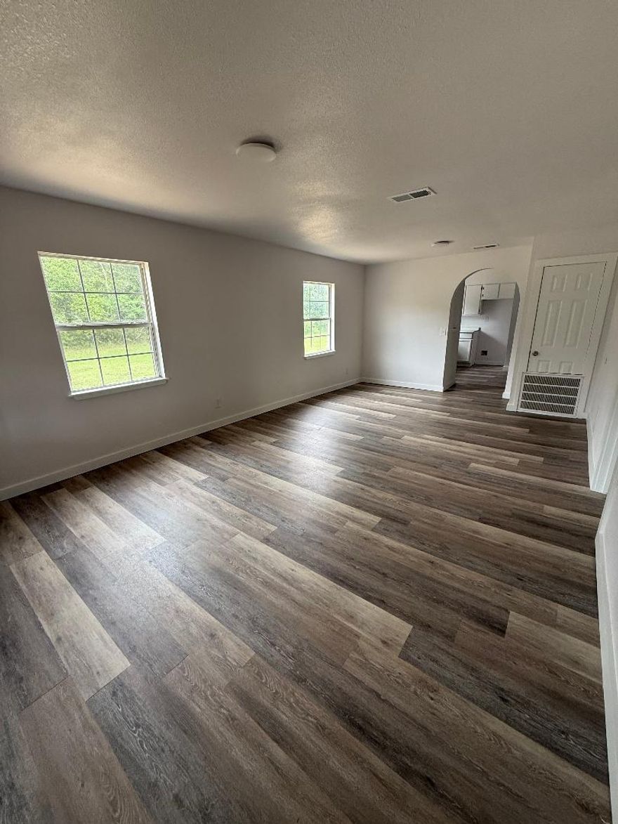 Three bedroom, one bath, newly renovated  home on five lots in city limits of Geneva, AL.  Conveniently located .3 miles from Geneva High School.  Corner lot faces two streets. City water and sewer. HVAC is under warranty.  Improvements include new bathroom shower and tub, new plumbing under house, new floor covering, new sheetrock, new cabinets, walls and trim freshly painted, new kitchen countertop, new light fixtures, switches & outlets, and a large porch with ramp.  Lot has potential for another home to be built beside it or possibility to parcel out other lots. Located less than 30 miles from Fort Rucker. Give us a call to schedule showing.