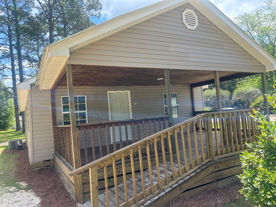 Three bedroom, one bath, newly renovated  home on five lots in city limits of Geneva, AL.  Conveniently located .3 miles from Geneva High School.  Corner lot faces two streets. City water and sewer. HVAC is under warranty.  Improvements include new bathroom shower and tub, new plumbing under house, new floor covering, new sheetrock, new cabinets, walls and trim freshly painted, new kitchen countertop, new light fixtures, switches & outlets, and a large porch with ramp.  Lot has potential for another home to be built beside it or possibility to parcel out other lots. Located less than 30 miles from Fort Rucker. Give us a call to schedule showing.