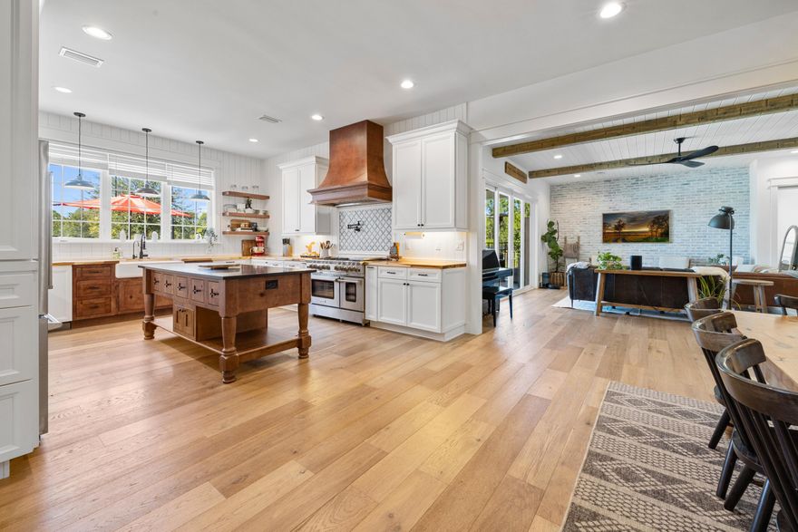 Modern farmhouse dreams meet next-level homestead living at 13796 State Hwy 81 in Ponce de Leon. Set behind full perimeter fencing on 20 pristine acres, this newly built estate delivers the rare balance of designer finishes, functional spaces, and true self-sufficient country living without sacrificing style. Inside the 5-bedroom, 4 full-bath, 2 half-bath farmhouse, clean lines and thoughtful details shine. The chef's kitchen anchors the home with white shaker cabinetry, under-cabinet lighting, custom vent hood, pot filler, butcher block countertops, and an oversized island that flows seamlessly into the open living space. A walk-in pantry with custom cabinetry and a dedicated coffee bar with beverage fridge elevates everyday living. The primary suite, tucked privately on the main level, feels like a retreat featuring a vaulted, beamed ceiling, abundant natural light, and a spa-inspired bath with freestanding soaking tub, glass-tiled rainfall shower, and a custom walk-in closet. Upstairs, two bedrooms offer ensuite baths and custom closets, while a bonus loft/bedroom above the 3-car garage includes its own AC, full bath, storage, and flexible space ideal for guests, a home office, or creative studio. Step outside and the lifestyle continues. The 3-car garage opens directly to a private resort-style patio complete with a 7.5-ft saltwater pool, hot tub, sauna, and cold plunge perfect for entertaining or unwinding at the end of the day. For equestrians, hobby farmers, or entrepreneurs, the 3,340-sq-ft barn is a standout feature, offering three horse stalls with automatic waterers and floor drains, an unfinished bath with plumbing and laundry hookups, and a climate-controlled upstairs office with LVP flooring and storage. Multiple access points, sliding barn doors, and ample equipment space make it as practical as it is impressive. The land itself is equally exceptional: five cleared pastures with water access, an 8-ft privacy fence across the front and down the left side, and a ½-acre stocked pond with floating dock. Additional amenities include pole and equipment barns, animal shelters, RV hookups, a treehouse with AC, chicken coop, greenhouse, raised garden beds, round pen, feed house, and pump house everything needed to live, work, and play on your own terms. This is more than a home, it's a turnkey Florida homestead designed for modern living, endless possibilities, and lasting legacy.