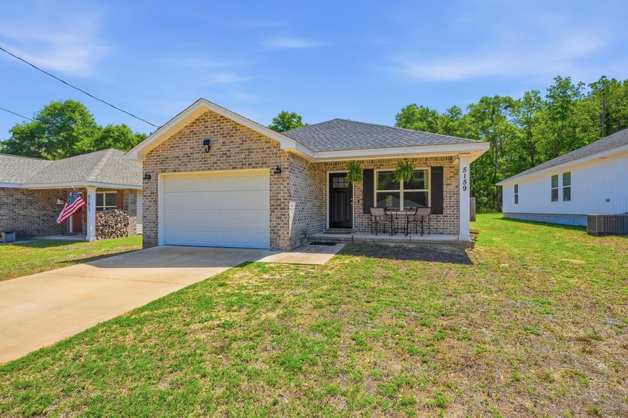 Move-in ready newer construction home in Crestview featuring 3 bedrooms, 2 baths, and an open-concept layout with luxury vinyl plank flooring and abundant natural light. The kitchen offers white cabinetry, stainless steel appliances, decorative lighting, and a large island with seating. The primary suite includes a walk-in closet and double vanity. Enjoy a covered patio, fully fenced backyard, custom entertaining area, and fire pit space. Conveniently located near shopping, dining, schools, and major commuting routes, including Duke Field, Eglin AFB, and Hurlburt Field.