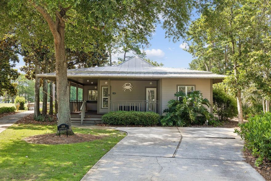 Wake up to peaceful lake views and the scenic 18th green of the Baytowne Golf Course from the comfort of your porch. Located in one of the most sought-after cottage-style neighborhoods within Sandestin Golf and Beach Resort, this charming 3-bedroom, 3-bath  one story home features an open floor plan with a spacious living area designed for relaxing and entertaining. The bright and airy living room showcases two sets of French doors that open to a large screened-in porch overlooking the lake, creating the perfect indoor-outdoor living space. The kitchen features granite countertops and stainless steel appliances. Two primary suites offer comfort and privacy; one opens directly to the porch and its tranquil lake views. Thoughtful landscape lighting enhances the home's charm and curb appeal in the evenings.  Whether you're searching for a second home or a full-time residence, this home presents an exceptional opportunity in a wonderful neighborhood. Conveniently located near Grand Boulevard at Sandestin, The Village of Baytowne Wharf, and the marina, you'll enjoy easy access to shopping, dining, entertainment, and recreation.