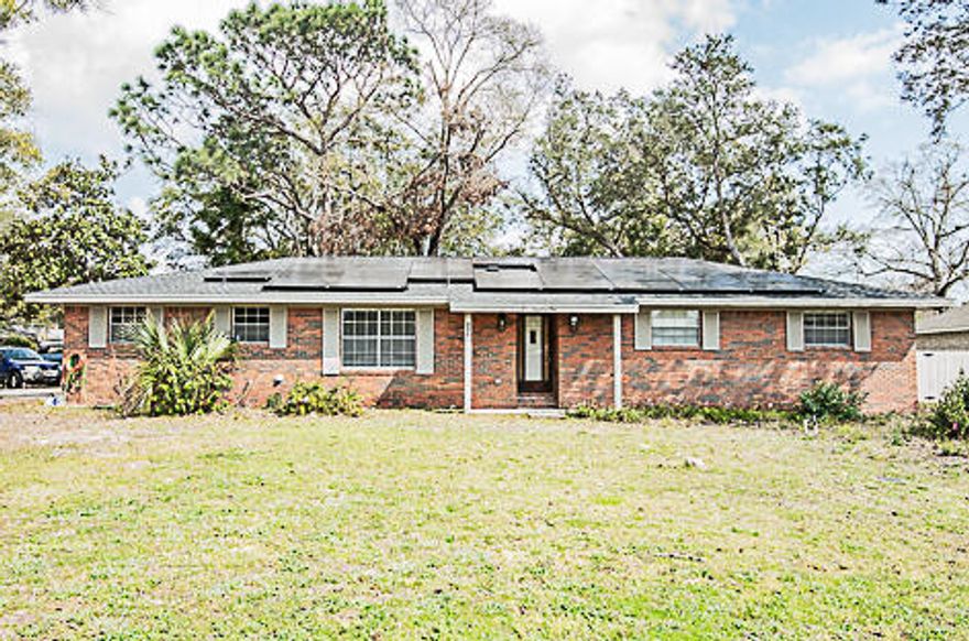 Available 05/12/2026....Quaint and located in the heart of Niceville, this 3-bedroom, 2-bathroom home features a solar subsidy for added value.  Spacious living room with vaulted ceiling and wood beams.  A wood burning fireplace for cozy Florida winters and newer paint throughout.  Large open kitchen boasts stove top as well as a wall oven, newer cabinets and counters, stainless appliances and brick accents. Over-sized 2 car garage, cabinet storage in garage and more.  Yard building and open back patio and fenced backyard.  No smoking or vaping in the home.  Pets will be allowed with a $400 non-refundable pet fee and owner approval.  Beautiful flooring and much more.