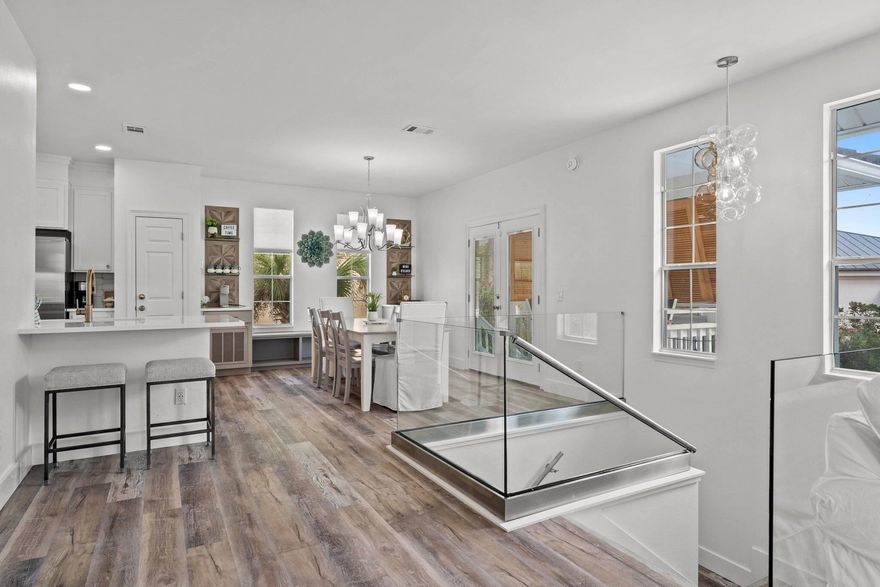 Located south of Highway 30A, and a short walk to the beach within the private, gated enclave of Longue Vue, this exceptional coastal residence offers a rare blend of refined design, effortless livability, and enduring investment appeal. Perfectly positioned between the architectural elegance of Alys Beach and the timeless charm of Rosemary Beach, the home provides both privacy and immediate access to some of the most coveted destinations along the Emerald Coast. Your arrival is framed by mature tropical landscaping and a decorative paver driveway, setting the tone for relaxed coastal sophistication. Upon entering, the home reveals thoughtfully curated interiors and well-appointed living spaces, all enhanced by a recent, comprehensive renovation completed by the current owners, ensuring modern comforts while maintaining timeless coastal appeal. Designed to accommodate a variety of lifestyles, the residence is ideally suited for full-time living, a refined second-home retreat, or a high-performing investment property. The first level features three guest bedrooms, including a private king suite with an en-suite bath, a guest room with a twin and trundle configuration, and a bunk room with two sets of twin bunksperfect for hosting family and guests with ease. A full guest bathroom and a dedicated laundry room complete this level with both convenience and functionality.
The second floor unfolds into a light-filled, open-concept living space designed for entertaining and everyday comfort. The great room seamlessly connects the living, dining, and kitchen areas, enhanced by clean coastal finishes and abundant natural light. The kitchen features bright white cabinetry, quartz countertops, premium appliances, and a secondary refrigerator for added convenience. Also on this level, the primary suite serves as a private retreat, featuring balcony access and a spa-inspired bathroom with double vanity and walk-in shower. An additional full bathroom supports the main living spaces.

Outdoor living is equally compelling, with a private backyard oasis complete with a resort-style pool and spa, along with multiple areas for lounging and dining. Enjoy private neighborhood beach access, all within a quiet, one-street gated community. Whether envisioned as a primary residence, a refined second home, or a strong income-producing investment, this property offers exceptional versatility in one of 30A's most desirable coastal settingsjust moments from world-class dining, boutique shopping, golf, and entertainment.