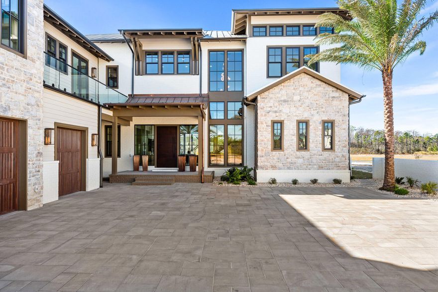 Recently completed and fully move-in ready, 75 N Southern Cross Lane offers a rare opportunity to own a 2025 Parade of Homes Winner in the prestigious gated community of WaterSound Camp Creek. Now strategically repositioned at $5,650,000, this nearly 7,000-square-foot estate blends exceptional craftsmanship, resort-style amenities, and timeless coastal design in one of the most exclusive settings along 30A. Designed for both everyday comfort and elevated entertaining, the residence features dual primary suites, soaring beamed ceilings, expansive living spaces, and a seamless balance of luxury and functionality. Every detail has been thoughtfully executed, delivering the advantages of brand-new construction without the delays of building. Inside, the home was designed to elevate both daily living and large-scale entertaining. A chef's kitchen is paired with a discreet secondary service kitchen, while two laundry rooms, an in-home elevator, and a 2.5-car garage add convenience throughout. Dedicated spaces include an executive office, fully equipped fitness room, state-of-the-art theater, and expansive game room with wet bar. The private wellness suite creates a true spa-like experience with a steam room, dry sauna, cold plunge, and dedicated shower.

Outdoors, the property transforms into a private resort-style retreat centered around a stunning pool, spa, and outdoor kitchen overlooking a peaceful pond. The detached carriage house above the garage offers guests complete privacy with its own entrance and full kitchen. Natural stone accents, a grand auto court, and striking coastal architecture further enhance the home's commanding curb appeal.

Ownership within WaterSound Camp Creek provides access to an unmatched lifestyle, including eligibility for exclusive WaterSound Club membership opportunities. Residents enjoy private beach access with chair and towel service, championship golf, resort-style pools with a lazy river, premier fitness and wellness facilities, tennis and pickleball courts, and exceptional dining and spa experiences at Camp Creek Inn, The Pearl, and WaterColor Inn.

With only 263 homesites, WaterSound Camp Creek remains one of the most sought-after luxury communities on the Gulf Coast. 75 N Southern Cross Lane represents a rare chance to secure a newly completed legacy property offering immediate enjoyment, extraordinary amenities, and a level of lifestyle value rarely found along 30A.