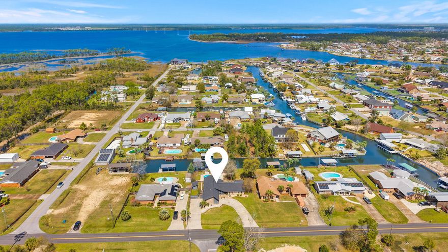 REFRESH!!  This waterfront home now offers a brighter, more inviting feel. The interior enhancements complements the home's coastal style.
Enjoy the best of coastal living with a private pool, canal frontage, and a covered dock--perfect for fishing, boating, and unwinding by the water. The welcoming courtyard entry, accented with fresh blooms adds to the home's charm and curb appeal. Pack your picnic and  head over to Shell Island and the Gulf!                                  

(buyer to verify measurements and information)