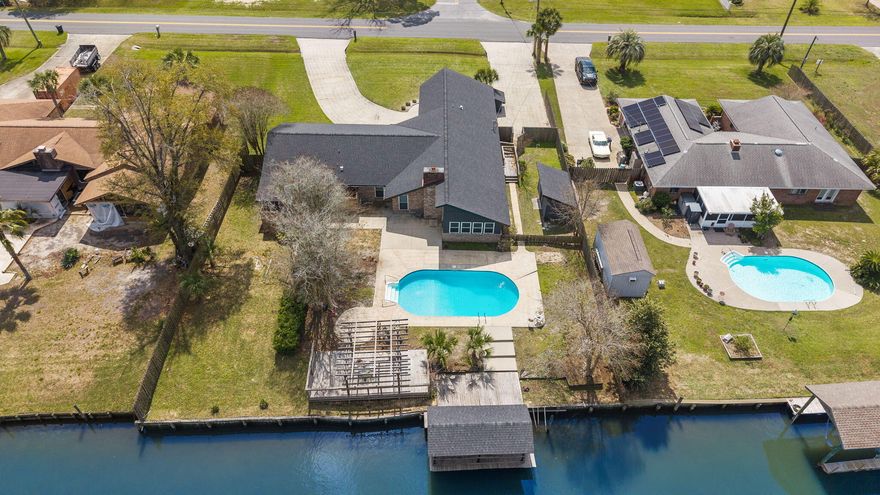 One level. One Owner. Built to be lived in and loved for generations. This WATERFRONT OPPORTUNITY now offers a brighter, more inviting feel. The interior and exterior enhancements complements the home's true coastal culture with a private pool, canal frontage, and a covered dock--perfect for fishing, boating, and unwinding by the water. Pack your picnic and head over to Shell Island. The residence features 4 bedrooms and 2.5 baths, including a flex room conveniently located just inside the entry from the drive-through garage, opening on both sides to create a porte-cochère style arrival and exit. No HOA
This NorthShore waterfront home is ready for its next chapter and offers an exceptional opportunity along the Emerald Coast.