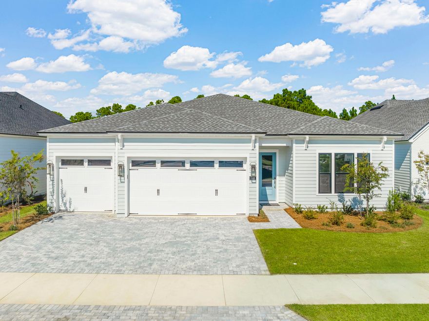 Welcome to this exceptional single story, 3 car garage, 4-bedrooms, 3-bathrooms plus bonus room home nestled in a beautiful gated community. As you walk in you are greeted by the wide foyer with 11' ceilings.  The gourmet kitchen features high-end finishes and ample cabinetry for all your culinary needs. The luxurious primary suite with tray ceilings offers a serene retreat with a generous walk-in closet and spa-inspired bath featuring dual vanities, a large shower with two shower heads, and spacious walk-in closet. Three secondary bedrooms share two hall baths, perfect for family or guests. One of which has a walk-in shower with frameless glass. The expansive great room and casual dining area boasts tray ceilings and abundant natural light, ideal for relaxing and entertaining. Multi slide glass sliding doors to the large covered lanai with pavers seamlessly extends your living space outdoors, perfect for enjoying the view of the private wooded area behind the home. Enough space for pool and outdoor living oasis. Additionally, a versatile flex room at front of home, perfect for a home office, playroom, or media area, is adaptable to suit your lifestyle. The 3-car garage with 10' ceiling, 8' garage door height with windows provides plenty of room for vehicles and storage.  This beautiful gated community enhances your lifestyle, offering easy access to a variety of amenities including a resort-style pool, clubhouse, fitness center, tennis and pickleball courts, playground, multi-purpose field, and much more. Short drive to public beach access, Pier Park shopping, dining and fun entertainment, airport, future FSU/TMH medical campus, future West Bay Center with Publix, and recreation outdoor activities at Frank Brown Park. This home is more than just a place to live, it's a lifestyle waiting to be embraced. Schedule a tour now and lets start your new home journey. Available for quick move-in.