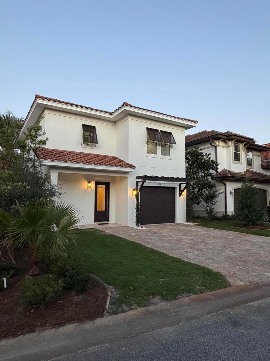 This beautifully designed Gulf Power EarthCents® certified Tuscany Coastal Home blends Mediterranean elegance with modern energy efficiency less than a mile from Destin's world-famous sugar-white beaches and emerald waters. Enjoy a healthy, active coastal lifestyle near boating, paddleboarding, golf, shopping, dining, and entertainment. Energy-saving features include a Trane 14 SEER HVAC with Nexia Home Intelligence, impact-resistant Low-E PGT windows, Frigidaire Gallery appliances, and a GE GeoSpring Hybrid water heater. Located in the gated Calusa Bay community with a resort-style pool, bathhouse, and low HOA fees of only $230 quarterly, this home is ideal as a primary residence, vacation retreat, or investment property near Destin Commons and the Emerald Coast's best attractions.