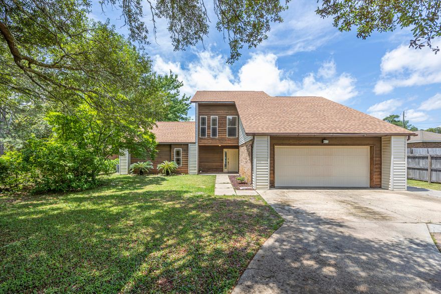 3 bed, 2 bath home with an inground pool in the Forest Heights Subdivision.  Featuring Vaulted ceilings, LVP flooring throughout the main level and carpet/tile upstairs.  The Main Level Master Bedroom walks-out to a private, patio area with a koi pond.  There is an additional bedroom and 1/2 bath on the main level with another bedroom and full bath upstairs.  The kitchen is equipped with stainless appliances and butcher block countertops.  Step outside to the back yard to enjoy the pool and plenty of outdoor living space.  A separate, detached garage/workshop with a full bath, offering excellent flexibility for hobbies, storage, or guest use. Conveniently located near military bases, schools, shopping, dining, and just a short distance to the beaches.