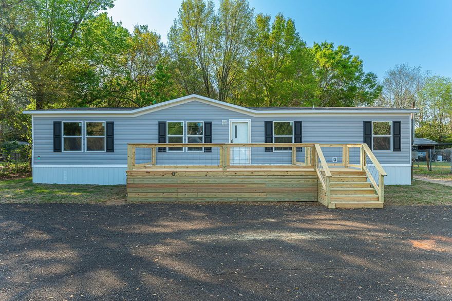 Welcome to your brand-new home in beautiful Milton, Florida! This wonderfully crafted 4-bedroom, 2-bathroom mobile home offers the perfect blend of modern comfort and affordable living.  Step inside to discover a spacious open-concept layout, ideal for both relaxing and entertaining. The bright living area flows seamlessly into a stylish kitchen featuring brand-new appliances, ample cabinetry, and a large island perfect for meal prep or casual dining.  The primary suite, on the opposite end of the home from the other three bedrooms, provides a private retreat with a generous bedroom, walk-in closet, and a well-appointed en-suite bathroom. Three additional bedrooms offer flexibility for family, guests, or a home office.  Enjoy the convenience of a dedicated laundry area, energy-efficient construction, and all-new systems throughout for peace of mind. Situated on a generous lot, there's plenty of outdoor space for gardening, pets, or simply enjoying the Florida sunshine. Located in a quiet area of Milton, just off Hwy 87 and Hwy 90, you'll appreciate the small-town charm while still being just a short drive to shopping, dining, and the beautiful Gulf Coast beaches. Don't miss your opportunity to own this move-in ready home--schedule your showing today!