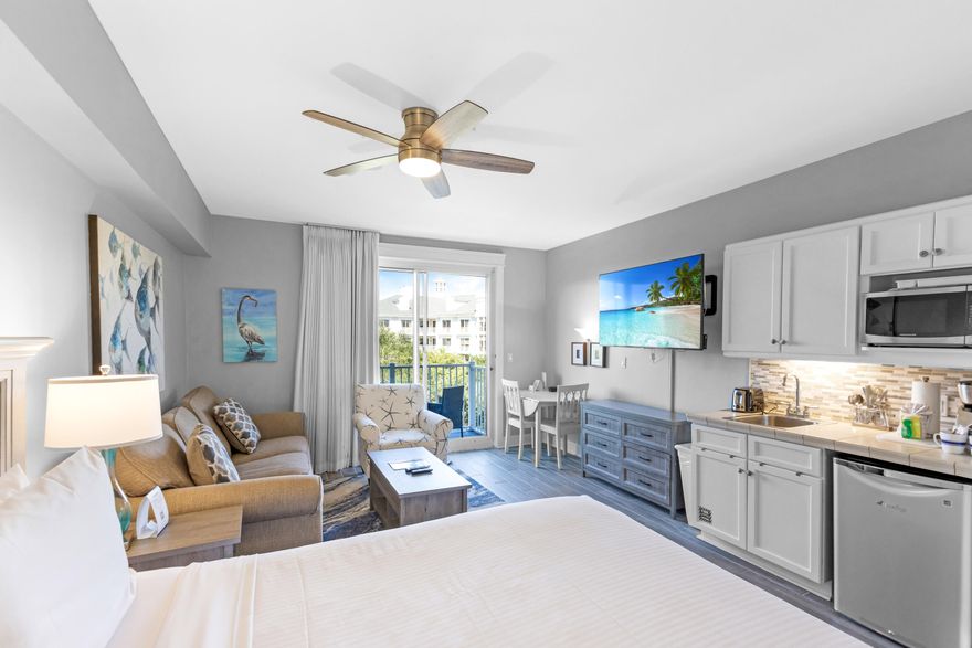 Experience resort living in this beautifully appointed studio condo located in The Grand Sandestin, nestled within the renowned Sandestin Golf and Beach Resort. This charming retreat features a full-size refrigerator, convenient kitchenette, and a spacious layout designed for comfort and style. Step out onto the private balcony and take in the stunning views of the resort grounds. The perfect place to enjoy your morning coffee or unwind after a day at the beach. Whether you're looking for a weekend getaway or an income-producing investment, this Grand Sandestin studio offers the ideal combination of luxury, location, and lifestyle. As an introduction to the Sandestin lifestyle, we invite our new owners to explore amenities that make Sandestin special. The listing brokerage and seller(s) are presenting the buyer(s) of this property with (2) 90-minute rounds of Tennis court time, a golf foursome at one of our three championship courses, and a round of golf for up to four (4) players at the unrivaled Burnt Pine Golf Club.

Sandestin Golf and Beach Resort features more than seven miles of beaches and pristine bay front, four championship golf courses, 15 world-class tennis courts, a 226-slip marina, a fitness center, spa and celebrity chef dining. Shop, dine and play at the charming pedestrian village, The Village of Baytowne Wharf and more. Inside the gates of the resort, residents enjoy a balanced lifestyle of high-class living, spanning the 2,400 acres from the beach to the bay. Everything within the gates of the resort is accessible by golf cart or bicycle. The entire resort is interconnected by miles of pedestrian, bike and golf cart paths that weave through groves of live oaks, meandering past natural lagoons, fountains, man-made lakes, and meticulously landscaped fairways.