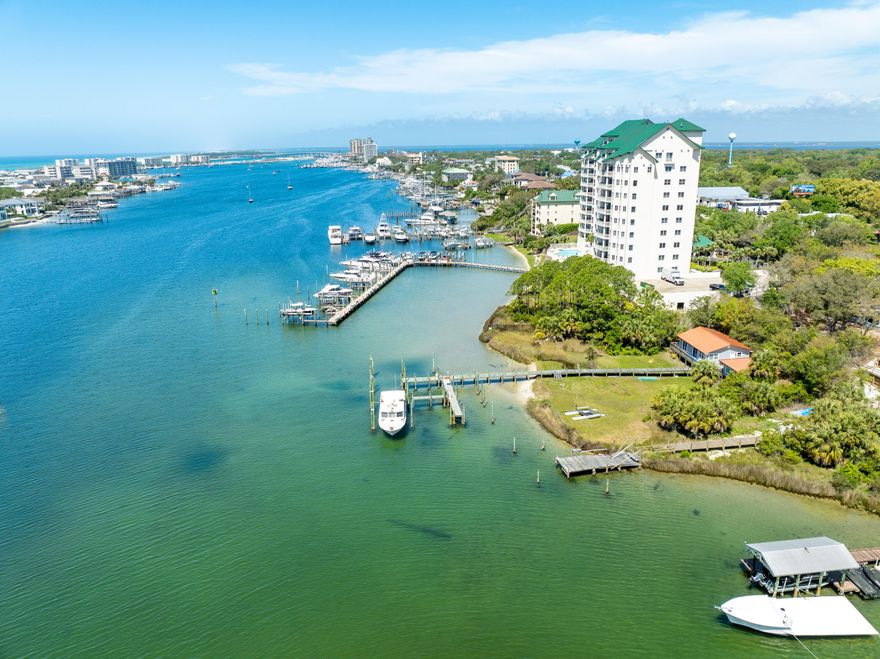 ASSUMABLE V.A. LOAN at 2.75% (restrictions apply and a buyer must be eligible and qualified; buyer must verify with licensed V.A. mortgage lender in the State of Florida).  Grand Harbor represents one of the most exclusive addresses on the scenic harbor of Destin, Florida.  This 5th floor villa offers an extraordinary view corridor (enjoyed throughout much of the interior, as well as from its expansive balcony oriented to the West) to the Gulf of America, as well as the East Pass and Choctawhatchee Bay.  This premier 4-bedroom, 4- bathroom, approximate 2,995 square feet lives more like a house floor plan and less like a condominium, yet the ownership has the luxury of onsite maintenance and management to focus their well-deserved time enjoying the phenomenal local lifestyle, and... perhaps peace of mind amid periods of travel.  The amenities of Grand Harbor include a garage, guest suite, and a gorgeous club room, as well as a pool, hot tub, and other desirable exterior features, most all of which have been updated within recent years.  Please inquire for further details.