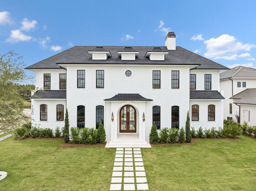 Discover refined coastal living in this stunning custom-designed home, offering over 6,000 square feet with 6 bedrooms in the main residence, a carriage house,  and private pool located in the exclusive WaterSound Camp Creek community.   Every detail of this residence combines timeless architecture with luxurious modern amenities.
The first floor welcomes you with a grand vaulted foyer that opens to an expansive living and dining area anchored by a brick fireplace and exposed distressed wood beams. The gourmet kitchen is a chef's dream--featuring a 60'' gas range, oversized island, ice maker, and a walk-in pantry with built-in shelving. A nearby coffee bar and wine cooler make entertaining effortless. The primary suite on the main level is a serene retreat, boasting a king-sized layout, a spa-inspired bath with a curbless shower, 6-foot soaking tub, and dual vanities. A large custom closet completes the suite. The first floor also includes a guest bedroom with ensuite bath, powder room, and a laundry/mudroom with direct garage access. Step outside to a private outdoor living area with a vaulted ceiling, outdoor kitchen, and resort-style pool with a water featureperfect for relaxing or hosting gatherings.
The second floor offers four spacious king bedrooms, each with ensuite baths, built-in desks, and custom closets. A media/TV room provides a cozy spot for entertainment or family relaxation. Elegant plaster arches, shiplap siding, and detailed millwork add warmth and sophistication throughout. Above the garage, a private carriage suite offers full guest accommodations, including a bedroom, bath, living area, and fully equipped kitchenetteideal for visitors.
Nestled between Scenic Highway 30A and Highway 98, WaterSound Camp Creek provides effortless access to the vibrant hubs of Alys and Rosemary Beach, as well as an array of top-tier dining and entertainment options synonymous with the 30A lifestyle. Directly adjacent to the Camp Creek entrance lies the bustling WaterSound Town Center, which plays host to a variety of events such as a weekly Farmer's Market, and is home to an array of storefronts including Publix, multiple dining establishments, a STEAM school campus, and medical facilities.
Additionally, the property includes a WaterSound Clubs Lifestyle Membership, granting privileges to the private beach club and exclusive access to premier golf courses such as Camp Creek, Sharks Tooth, Origins, and the forthcoming Davis Love course in the vicinity.
Don't miss the opportunity to delve deeper into the allure of WaterSound Camp Creek, a highly coveted destination for both permanent and seasonal residents along 30A. Contact us today to uncover more about this exceptional offering.
Home is currently under construction with completion in early Spring 2026