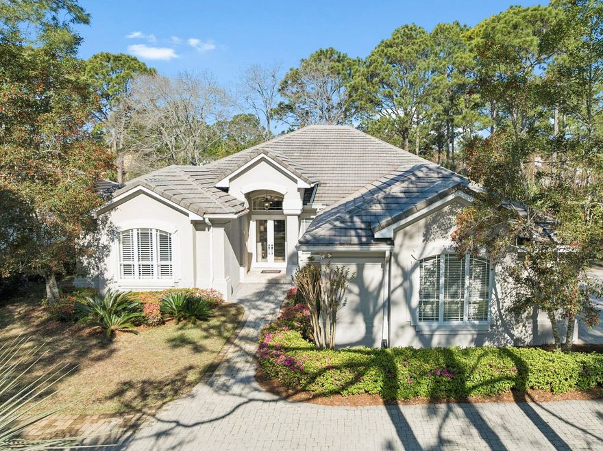 Welcome to 1464 Baytowne Avenue, a beautifully positioned 4 bedroom, 3 bath home set along the 17th tee of the Raven Golf Course in the heart of Sandestin. Situated on an estate-sized lot along one of the community's main drives, this Arthur Rutenburg designed home offers a rare combination of convenience, space, and serene golf course living.

From the moment you arrive, lush landscaping and mature greenery create a sense of privacy and tranquility, setting the tone for the welcoming retreat that awaits. Enjoy peaceful golf course and lake views from the screened-in porch overlooking the beautiful backyard, perfect for quiet mornings or relaxed evenings.

Inside, expansive living spaces are thoughtfully designed for both everyday comfort and effortless entertaining. A formal dining  room and elegant sitting room offer a warm welcome for guests, while the open-concept kitchen flows seamlessly into the breakfast nook, living room, and leisure room, creating a natural gathering space at the heart of the home. This central area is both spacious and functional, enhanced by a conveniently located full bath for added ease when entertaining guests.

The primary suite is a true retreat, generously sized and filled with natural light, offering tranquil views of the backyard and direct access to the screened porch. The en suite bath features ample space with a separate shower and soaking tub, a water closet, and a large walk-in closet, providing practicality with a luxurious feel.

The split floor plan enhances privacy, with two well-proportioned guest bedrooms connected by a Jack and Jill bath, offering both convenience and versatility for family or visitors. Each room provides ample space and natural light, creating a welcoming environment and comfortable living. The fourth bedroom adds flexibility to the home's layout, easily functioning as a guest suite, home office, or additional living space depending on your needs.

Additional features continue to elevate the home's livability, including a generously sized laundry room that doubles as a functional mudroom, ideal for everyday organization. The oversized three-car garage provides abundant space for vehicles, golf carts, and storage, further enhancing the practicality of the home while maintaining its sense of comfort and ease.

Located within a quiet, non-short term rental neighborhood, this home offers a more peaceful residential feel while still being just moments from all that Sandestin has to offer.

Sandestin residents enjoy abundant amenities, including 5-Star golf courses, tennis and pickleball, biking and hiking trails, a 210-slip full-service marina, and the vibrant Baytowne Wharf for dining, activities, and shopping. The ever-growing Grand Boulevard Town Center, featuring restaurants, retail shopping, Starbucks, a movie theater, and Publix Grocery, is a short golf-cart ride away.