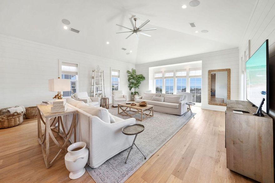 This well-appointed 7-bedroom, 7 full-bath, 3 half-bath coastal residence offers an exceptional blend of space, functionality, and prime 30A location--with no HOA and just a short walk to two public beach accesses. Thoughtfully designed for comfort and versatility, the home features two bunk areas, two separate living rooms, and multiple balconies, creating generous gathering spaces while still allowing for privacy--ideal for hosting large groups. Set on an oversized lot, the outdoor living experience is a true standout. A large heated pool, summer kitchen, and private backyard oasis shaded by mature oak trees provide the perfect setting for relaxed afternoons and evenings after the beach. The third-floor living room and kitchen serve as the heart of the home, capturing stunning Gulf views and offering a natural space for entertaining. Anchored by a 14-person dining table and ample bar seating, the chef's kitchen is equipped with stainless steel appliances, custom cabinetry, abundant storage, and designer finishes that balance style with functionality. An elevator offers convenient access to all three levels. The first floor includes a spacious mudroom with built-in cubbies and a washer and dryer, while two additional laundry areas on the upper levels make hosting guests effortless. Ideally located on the east end of 30A, between Alys Beach and The Big Chill, you're moments from dining, boutique shopping, and entertainment. With proven rental performance generating approximately $270,000-$315,000 annually, this property presents a compelling opportunity as a second home or investment along one of 30A's most sought-after corridors.