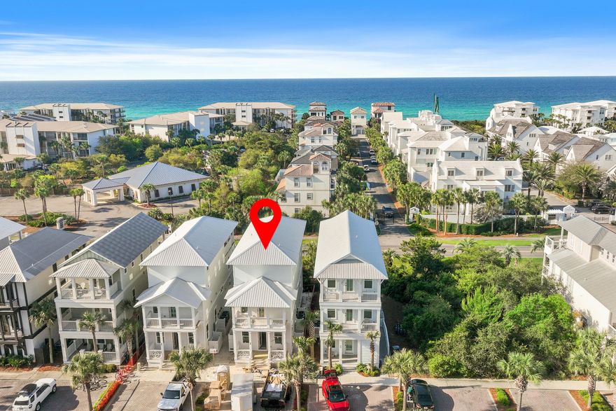 Situated in the highly desirable Seacrest Beach community along scenic 30A, this stunning new construction beach home offers the perfect blend of luxury and relaxed coastal living and comes fully furnished. The residence features five generously sized bedrooms and four and a half beautifully appointed bathrooms, highlighted by elegant 9-inch wide engineered wood plank flooring that flows throughout the home. Designed with both comfort and flexibility in mind, the layout includes two primary suites--one conveniently located on the first floor and another on the third--providing ideal accommodations for owners and guests. The home also features three separate living areas, giving everyone space to gather or unwind. The main living room on the first floor serves as the central hub and showcases a dramatic 72-inch three-dimensional electric fireplace, adding both warmth and a modern focal point.

On the second floor, you'll find another comfortable living area that opens to a covered porch, creating the perfect setting for relaxing or entertaining while enjoying the coastal breeze. The open-concept kitchen is designed to impress with stylish shaker cabinetry, quartz countertops, a beautiful tile backsplash, and premium appliances that will delight any home chef. Just off the kitchen, a thoughtfully designed wet bar with open wood shelving, a wine refrigerator, and an ice maker makes hosting effortless.

The third level offers yet another spacious living area along with a large porch featuring a summer kitchen and views overlooking Scenic 30A--an ideal spot for gathering with friends and family.

This home also incorporates modern efficiency and convenience, including a high-performance Rinnai 11.5 GPM tankless water heater that delivers continuous hot water, as well as a washer and dryer.

For effortless beach days, the Seacrest Beach community shuttle provides quick transportation to the Gulf.

Enjoy starting your mornings at a nearby café or exploring the exceptional dining, shopping, and entertainment found just a short distance away in Rosemary Beach and Alys Beach. Spend your days relaxing along the world-famous white sand beaches of 30A, casting a line along the coast, or playing a round at Camp Creek Golf Club. Outdoor enthusiasts will also love visiting Camp Helen State Park, where opportunities for birdwatching, hiking, kayaking, and fishing await along the tranquil shores of Lake Powell.