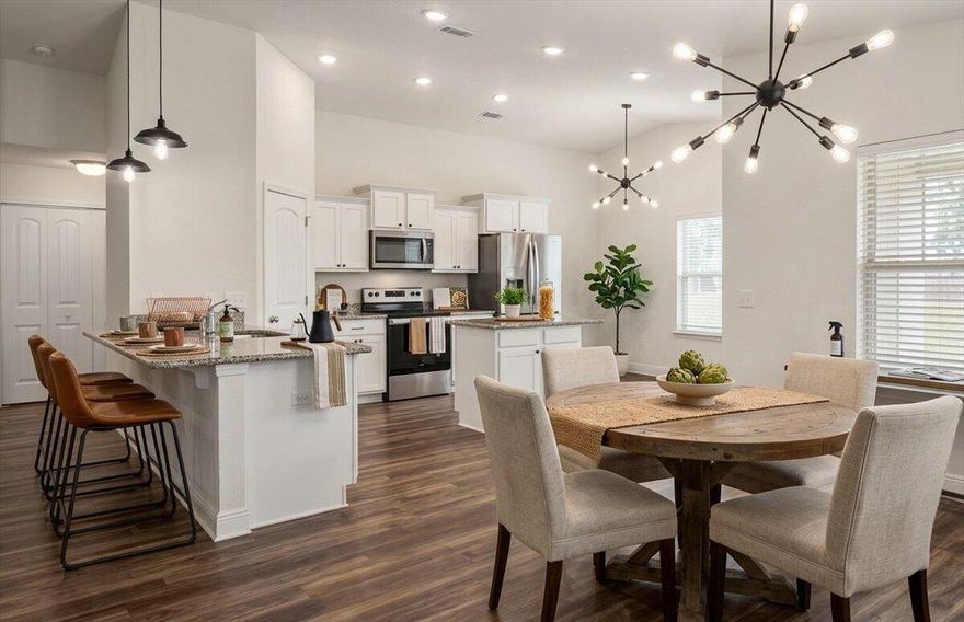 Welcome to Heather's Place Community Phase 2, a thoughtfully designed neighborhood featuring underground utilities, sidewalks, public water, and sewer, creating a clean and well-planned community environment. This energy-efficient ranch-style home offers modern comfort paired with stylish finishes throughout. Step inside to an open-concept floor plan that seamlessly connects the living, dining, and kitchen areas perfect for everyday living and entertaining. The kitchen is equipped with stainless steel appliances, including a top-of-the-line Samsung four-door refrigerator, and is beautifully finished with granite countertops that continue into both bathrooms for a cohesive, upscale feel. Luxury vinyl flooring runs through the main living and wet areas, providing both durability and contemporary style. The primary suite serves as a private retreat, featuring a soaking tub, dual vanity, separate tiled shower, and a spacious walk-in closet designed for comfort and functionality. Enjoy living in a community designed with convenience and efficiency in mind while being close to everything the area has to offer. Schedule your private showing today and come see all that this beautiful home in Heather's Place has to offer.