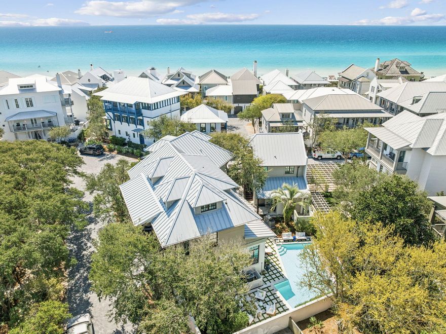 Positioned just 100 steps from the sugar white sands and emerald waters of the Gulf, 216 Round Road offers a rare opportunity to own a fully renovated and designer furnished estate in the heart of Rosemary Beach. Set on one of the community's most private corner lots facing a beautiful park, this Mediterranean inspired coastal residence blends timeless architecture with elevated modern updates, creating a home that is both refined and welcoming.
Spanning three levels in the main residence plus a beautifully updated carriage house, the property has undergone extensive renovations. A grand mahogany entry door opens to a dramatic great room featuring pecky cypress ceilings, Venetian plaster walls, and an open concept layout designed for seamless entertaining. Refinished 100 year heart pine floors run throughout the main house and carriage house, complemented by new lighting.
The fully remodeled chef's kitchen is outfitted with premium appliances including a 48 inch Wolf six burner gas range with pizza oven and griddle, SubZero 42 inch refrigerator, SubZero wine chiller and ice maker, dual KitchenAid dishwashers, Native Trails stone sinks, and Cambria quartz waterfall countertops. 
The primary suite serves as a private retreat with spa inspired his and hers baths featuring new quartzite counters, custom vanities, upgraded Kohler and Delta fixtures, steam and Jacuzzi elements, Italian terrazzo flooring, designer Italian and Swedish wallpaper, and custom shower doors. Additional baths have been thoughtfully updated with elevated tile selections and premium finishes.
The flexible floor plan offers multiple guest suites and a third level designed for family living with bunk rooms, lounge space and a working desk area. Outdoor living is exceptional, with covered loggias, alfresco dining spaces, and a heated pool. A beautifully reimagined backyard retreat showcases elegant white stone pavers, updated pool coping, and thoughtfully refreshed surrounding spaces serving as the finishing touch in the refined evolution of this exceptional home.
The carriage house has been fully refreshed with new cabinets, counters, appliances, offering ideal accommodations for guests or rental flexibility.
Offered fully furnished with curated interiors by Tracery, Beau Interiors, Not Too Shabby, Hunter Douglas, and Restoration Hardware, this home delivers a sophisticated yet relaxed coastal aesthetic.
Rosemary Beach is renowned for its cobblestone streets, iconic architecture, and walkable town center filled with award winning dining, boutique shopping, and year-round events. Residents and guests enjoy private beach access, multiple resort style pools, clay tennis courts, parks, and an unmatched sense of community along Scenic Highway 30A.
With the Gulf just outside your door and every detail thoughtfully completed, 216 Round Road represents turnkey luxury living in one of the most sought after beach communities in the country.