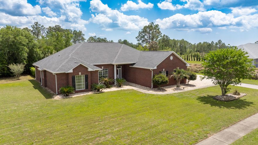 Located in the gated, golf cart-friendly Windswept community in Freeport, this well-maintained 3BR/2BA home sits on a private 0.73-acre corner lot. The split floor plan features tile and laminate flooring, a gas fireplace, and a spacious primary suite with walk-in closet, garden tub, and separate shower. Enjoy outdoor living with a screened lanai and covered in-ground pool, plus covered and open porches. Additional highlights include a walk-in laundry, mudroom, oversized 2-car garage, enclosed golf cart garage, and extra parking for RV or guests. Brick construction, energy-efficient systems, and a Generac generator add peace of mind. Community amenities include golf, pickleball, tennis, pool, and more. Approximately 30 minutes to Gulf beaches.
 Roof and HVAC were updated in 2023. 

Parking and storage are ample, with an oversized attached two-car garage, a separate enclosed golf cart garage, and additional driveway space with room for recreational vehicles. A covered portico connects the golf cart garage directly to the home through the mudroom, offering added convenience.

The home is constructed with brick siding and a composite shingle roof. Energy features include central electric air conditioning, high-efficiency heating, ceiling fans, and an electric water heater. A Generac whole-home generator provides added reliability during power outages.

Windswept offers a range of amenities including gated entry, golf course access, pickleball and tennis courts, a community pool, playground, and a pet-friendly environment.

Located in Freeport, Florida, the property offers a peaceful residential setting with convenient access to shopping, dining, and daily services. The Gulf Coast's beaches are approximately 30 minutes away, along with the attractions and events throughout Walton County and the scenic Highway 30A area.

This property offers a combination of space, comfort, and community in a well-established neighborhood. Schedule a showing to see all that this home has to offer.