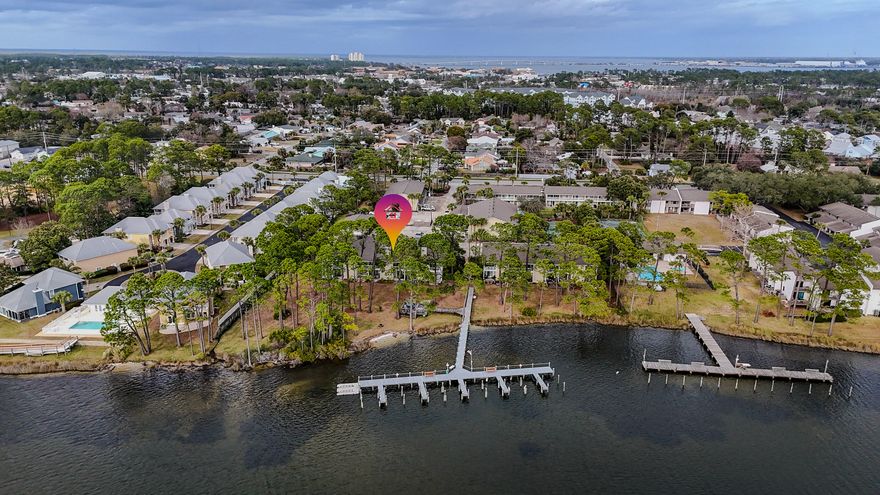Waterfront living at Grand Lagoon Cove! This 2BR/2BA lagoon-front condo offers direct water views, dock access, and a rare opportunity to own in one of North Lagoon's true waterfront communities. Enjoy peaceful mornings from your covered balcony overlooking the lagoon and green space. Community amenities include a pool, tennis courts, and shared dock access (slip use subject to HOA rules and availability). Recent updates include LVP flooring, stainless appliances, water heater replaced October 2025, and HVAC replaced in 2013. Short-term rentals are permitted per association guidelines. Conveniently located near beaches, marinas, dining, and St. Andrews State Park. Grand Lagoon Cove is a true lagoon-front community offering direct water access along highly desirable North Lagoon Drive. The community features a pool, tennis courts, and shared dock facilities designed for enjoying the boating lifestyle. There are approximately 10 boat slips serving 54 units, and slip assignments are managed by the association on a first-come basis subject to availability and HOA rules. Slips are generally intended for resident owners, and renters are not eligible to obtain slip assignments. Buyers should verify current availability, any waiting list, and applicable fees directly with the association. Inside, the unit offers a functional two-bedroom, two-bath layout with lagoon views from the covered balcony, making it suitable as a primary residence, second home, or investment property. Located just minutes from Gulf beaches, public boat ramps, marinas, shopping, and restaurants, this property provides convenient access to everything Panama City Beach has to offer while maintaining a quieter waterfront setting. All ages, measurements, square footage, rental guidelines, boat slip availability, and room sizes are approximate; buyer to verify all information deemed important.