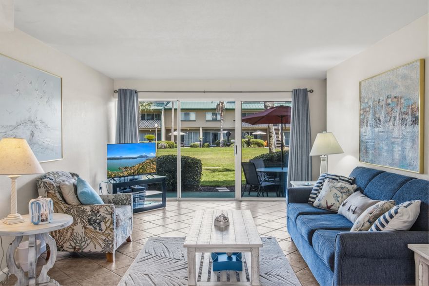 Experience the charm of coastal living at Seaspray with this inviting 1-bedroom, 1-bath condominium located on the desirable west side of the complex. Thoughtfully designed with an open layout, this residence offers comfortable space for family and guests, featuring a spacious upstairs bedroom and additional sleeping accommodations with a downstairs sleeper sofa.

The large ground-floor patio opens directly to Seaspray's expansive green space, creating an ideal setting for outdoor relaxation, games, and gathering after a day at the beach. Residents and guests enjoy a variety of community amenities including a pool, fitness center, sauna, laundry facilities, community room, grilling area, shuffleboard, open recreational lawn space, and a playground area.

Seaspray is known for its private beach access and wide stretch of sugar-white sand, offering an exceptional opportunity to enjoy the coastal lifestyle along the Gulf. Whether you are seeking a personal beach retreat, vacation getaway, or investment opportunity, this condo offers the perfect place to relax and make lasting beach memories.