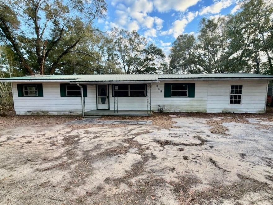 Originally built in 1961 with an effective age of 2000, this 5-bedroom, 2-bath REO home is priced to move. Resting on approximately .35 acres, the property is fully enclosed with chain-link fencing and features vinyl siding, a metal roof, and a detached workshop. Inside, you will find a split-bedroom design: three bedrooms and one bath are situated on one side of the home, while the remaining two bedrooms and a second full bathroom sit on the opposite side of the central living and kitchen areas. Conveniently located just a few miles from downtown Crestview, the hospital, and interstate access, this is a 'must-see' for those seeking sweat equity or a solid long-term rental property. Note: This home may qualify for Vendee™ seller financing but may not qualify for all traditional financing.