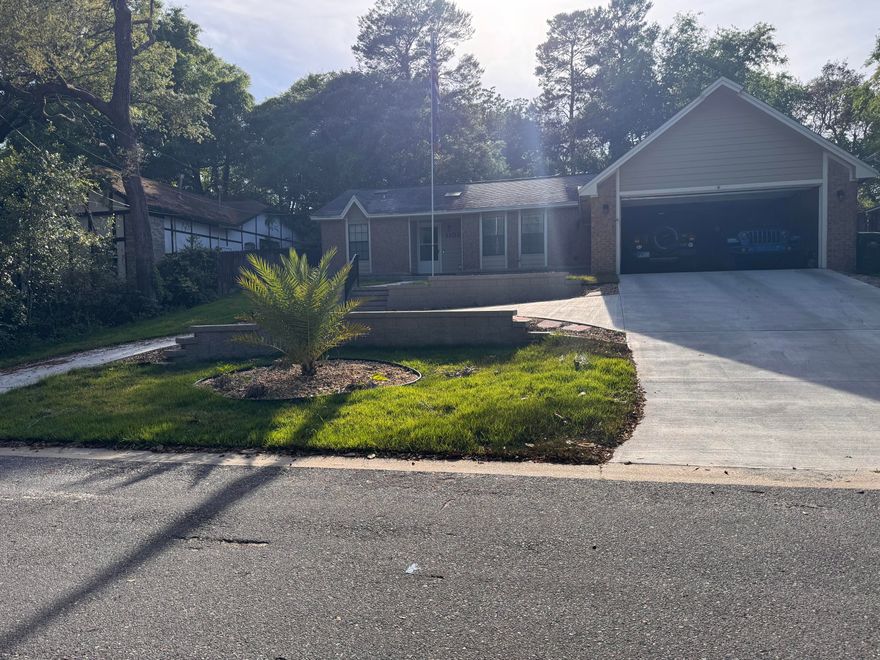 Charming home in the heart of Niceville. Large family room with a wood burning fireplace.  Family room is a Florida Room/Flex Space that has a separate PTAC HVAC with it's own dedicated electrical line.  The roof was replaced in 2019, the HVAC and Gas Water were replaced in 2018. Nest Thermostat to help with energy costs. The two-car garage has pull down storage and there is a large shed in the back yard. The landscaping in the front yard is newly added and has all new sprinkler system.  The front flower beds are drainage fields for the roof runoff.  Across from the home is woodlands with a creek that drains to a pond that has had ducks and is quite peaceful.