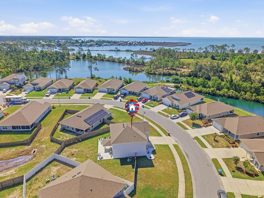 Discover this beautifully maintained 2019-built single-family home in the desirable Bridge Harbor community. Offering approximately 2,448 square feet of living space, this 4-bedroom, 2.5-bathroom, two-story residence provides an ideal blend of modern comfort, functional design, and convenient Florida living.

Step inside to an inviting open-concept layout perfect for both everyday living and entertaining. The spacious kitchen features ample counter and cabinet space, a large island with breakfast bar, and a walk-in pantry--making meal prep a pleasure. Adjacent living and dining areas flow seamlessly, while a versatile flex space offers options for a home office, additional dining, or a cozy living nook.

Upstairs, the primary suite comfortably accommodates king-size furniture and includes a generous walk-in closet plus a luxurious en-suite bath with soaking tub, separate shower, and double vanity. Three additional bedrooms provide plenty of space for family, guests, or a home gym. The home also boasts a 2-car garage and thoughtful details like double-pane windows throughout.

Outside, enjoy the covered front and back porches overlooking a fenced yard that backs up to a serene pond--perfect for relaxing evenings or morning coffee. The lot offers approximately .33 acres.