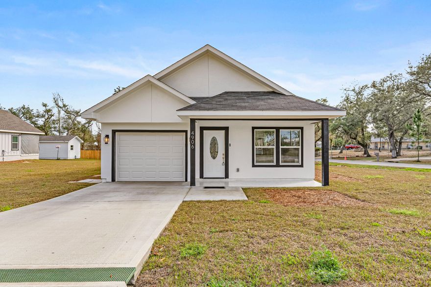 Modern Farmhouse on a Corner Lot, walking Distance to the Boat Ramp! Stunning, thoughtfully designed with high-end finishes and exceptional craftsmanship. Offering 3 spacious bedrooms and 2 beautifully appointed bathrooms, plus a third additional full  bathroom on back of the house area, this home features tile flooring throughout, creating a seamless and elegant flow from room to room. Step inside to admire the vaulted ceilings and hurricane-protected windows, providing both natural light and peace of mind. The gourmet kitchen is a dream, showcasing white granite countertops, soft-close cabinetry, stainless steel appliances, a deep sink, stylish backsplash, recessed lighting, and a spacious walk-in pantry perfect for everyday living and entertaining Enjoy Florida living at its finest on the open back porch, complete with a fully equipped outdoor kitchen featuring deep sink, stove/grill, storage. Ideal for gatherings, grilling, and relaxing year-round.
The floor plan includes a spacious master suite with an elegant tray ceiling. The master bathroom offers a walk-in shower with tile-accented walls, a large walk-in closet, and beautiful French doors that open directly onto the back porch, creating a seamless indoor-outdoor retreat.
An additional bonus area with its own full bath and tile flooring provides incredible versatility--perfect as a guest suite, home office, gym, or hobby space.
This modern farmhouse blends style, comfort, and functionality, making it the perfect place to call home.