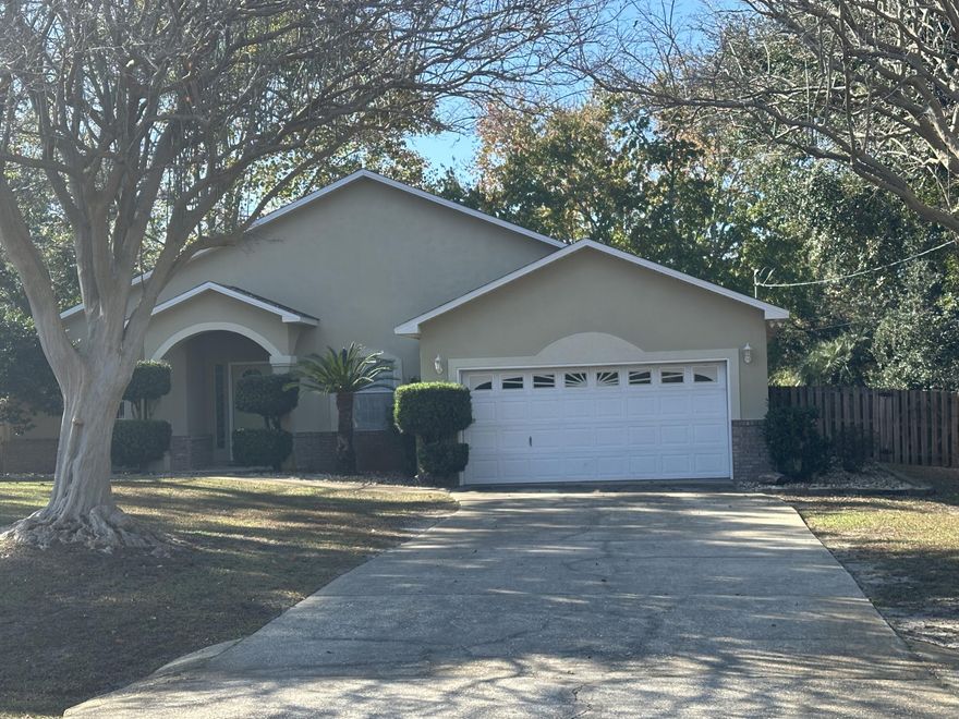 Well located at the front of the Holley By The Sea community.  This 4/2 has a new roof installed in 2025. Recently added also is a large (12' X 33') screened Florida room with ceiling fans with lights. It is accessible both from the living room and the master bedroom.  The kitchen has been upgraded, all counter tops are top quality granite, appliances stainless steel. Exceptionally well done tile floors  throughout. Master bath recently upgraded large walk in shower. Handicap accessories have been added to both baths.
Total square footage or the house is 2,974 sq. ft. with the fully screened Florida room. This 1/2 acre property provides lots of area for the mature trees and landscaping.  The back yard is fully fenced with a gate for a vehicle. All this located in a quiet, friendly neighborhood where parents meet their children at the nearby school bus stop.