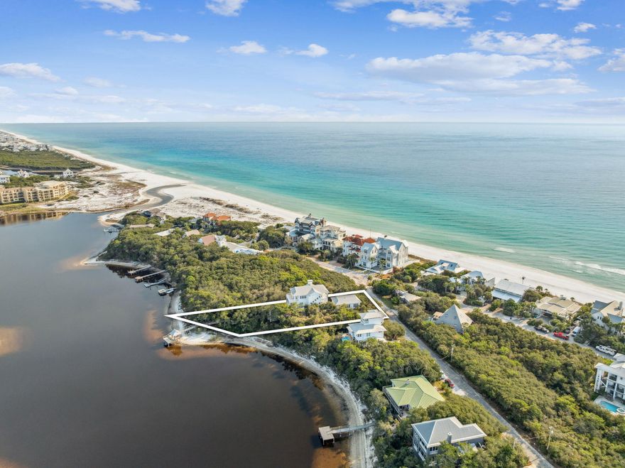 Designed with entertaining in mind, this lakefront residence in Blue Mountain Beach sits on Big Redfish Lake, one of the world's rare coastal dune lakes, offering peaceful lakefront living with the Gulf just across the street. Spanning approximately 5,276 square feet, the home features thoughtful design, high-end systems, and refined finishes throughout. The first floor offers 12-foot ceilings, recessed lighting, and a well-equipped kitchen ideal for hosting, complete with Sub-Zero appliances and a raised ventilation system over the stove. A custom pantry includes a dedicated juicing area with its own sink. A nearby half bath and elevator access to all levels add convenience.

The second floor is anchored by a private primary suite featuring Brazilian walnut flooring, a spa-like bathroom, a large walk-in closet with custom shelving, built-in sound wiring, and a kitchenette. A secondary guest bedroom, built-in bookcases, and an additional kitchenette with a microwave, sink, and beverage chillers provide flexible living options. A large patio with lake views connects directly to the carriage house, creating seamless indoor-outdoor flow.

The third floor is designed for entertaining, offering Brazilian walnut flooring, a gas fireplace, automatic window shades, ceiling speakers, a projector, theatre seating, two Sub-Zero wine coolers, a half bath, and a spacious lakefront patio. The elevator was serviced and inspected in 2025.

The gated outdoor space includes a pool with screened enclosure, irrigation system, direct lake access, and a private dock with power and water. The home is supported by three HVAC systems, including two geothermal units, one newly installed in 2025, along with a conventional system added in 2023.

The 812-square-foot carriage house offers a private bedroom with two closets, a full bath with walk-in shower, and a dedicated laundry room, ideal for guests or extended stays.

Located with easy access to the Timpoochee Trail for biking and walking, this home offers proximity to everything Scenic 30A has to offer. Sugar-white sands, emerald Gulf waters, fine dining, beloved local dives, and favorites like Blue Mountain Beach Creamery are all just moments away, delivering a rare combination of coastal dune lake living, Gulf convenience, and elevated design in the heart of Blue Mountain Beach. Contact us for more information or a private showing.



All information is deemed reliable and provided for informational purposes; buyers are encouraged to independently verify all details.