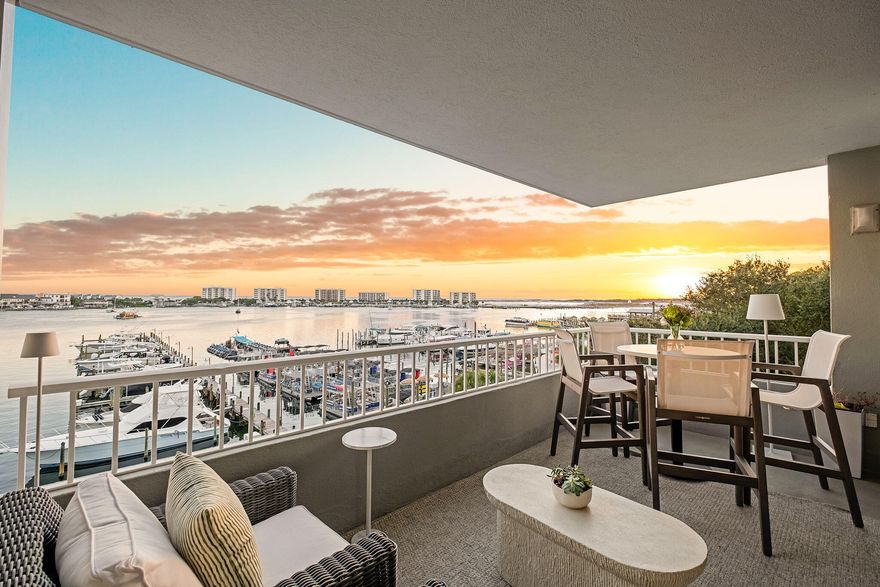 Unit 305 is a rare West end unit at the coveted Destin Yacht Club! This incredible condominium has been fully renovated and includes a deep water boat slip (#6) with a 30,000lb boat lift. With a stunning full wall of windows on the West side, you are able to capture some of the best sunsets on the Emerald Coast! This low floor unit offers amazing views of the Destin Harbor and Gulf. Walk to some of the best dining and entertainment in Destin. The iconic Harborwalk leads right up to this complex, so no need to drive! The complex has gorgeous common areas, fitness center, and pool. Destin Yacht Club recently had all new windows and doors installed in all units, new exterior paint, and a new roof installed. Opening the sliding doors of this condo really opens up the living space and truly gives you that coastal experience. 

Unit 305 has special features including a full master walk in closet, huge master shower, double vanities, and Erika Powell grasscloth covering the wall in the dining area. A Scotsman "nugget" ice machine is the highlight of the kitchen. Electric blinds are installed on the West window wall. Floors are all ceramic tile making this condo easy to clean and very durable. 

This condo has an enclosed storage unit perfect for beach chairs, floats, and the like. Inside the unit, a former sauna has been converted into a large storage closet.

The included boat slip #6 is on the West dock right in the middle of the Marina. You have easy access to the Harbor from this slip. The 30,000lb boat lift can be operated with a remote control. Currently, the lift is configured for stern in docking. This makes wash down and shore power connections easy. Slip 6 and the lift will accommodate 40+ feet in length. The slip without existing lift can accommodate up to a 55 foot boat.

Destin Yacht Club is one of the most well known and desired complexes in this area. No short term rentals are allowed making this a very peaceful and quiet place yet being only minutes from all of the entertaining one could desire. You have gated parking in addition to gated owners parking if desired. All entrances to the complex require a code or fob making this a safe spot to live year round or for weekending. The common areas are fantastic including a large kitchen/bar, piano area, recreation room with billiard and pool table, and a covered outdoor bar. The pool has amazing views of the Harbor and sunsets. 

These West end units rarely become available especially on a lower floor. Call today!