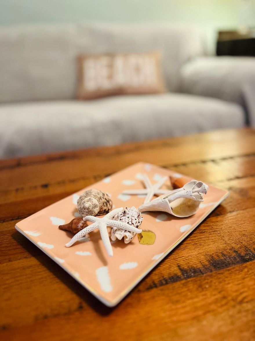 This Florida Cottage will be your piece of paradise!  Just steps away from Garniers Beach Park on the bay.  You'll enjoy the beach, swimming, a park, fishing, and a boat launch!  Plus, you're only 3 miles to the beautiful beaches of Okaloosa Island!  When you're not enjoying the water, you'll be enjoying this sweet cottage.  The 2016 renovation updated this home and original hardwood floors bring authentic charm and character too.  The sweet and sunny sitting room greets you with a welcome smile when you step inside.  The open living, dining and kitchen area make everyday a breeze.  Have a seat at the granite countertop breakfast bar.  Sip some tea and chat while the cook is trying out a new recipe on the gas stove. Step out back for a BBQ, s'mores or some cornhole.